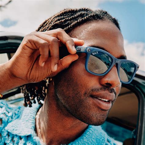 Traveler adjusting Ray-Ban Meta glasses outdoors